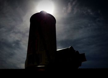 Low angle view of built structure against sunset