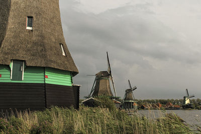 Traditional windmill against sky