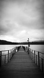 Pier over sea against sky