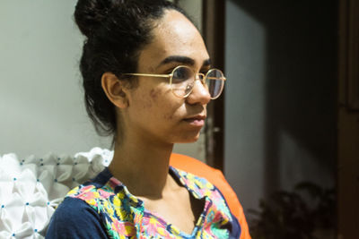 Close-up portrait of woman with eyeglasses