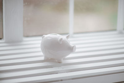 Close-up of piggy bank on table