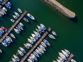 High angle view of boats moored at harbor