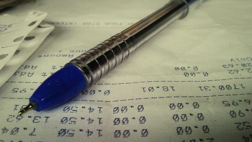 Close-up of pen on book