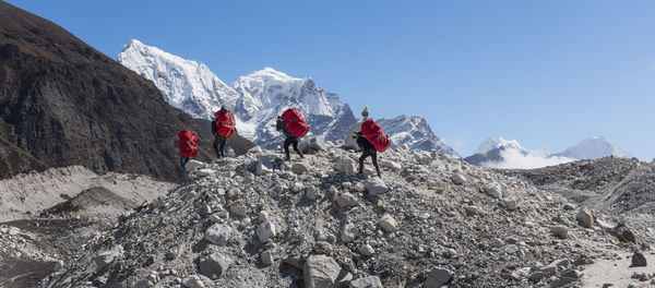 Nepal, himalaya, khumbu, everest region, porters on ngozumpa glacier
