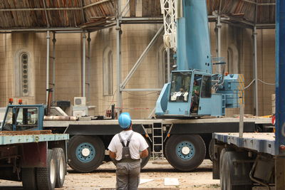 Worker operating crane