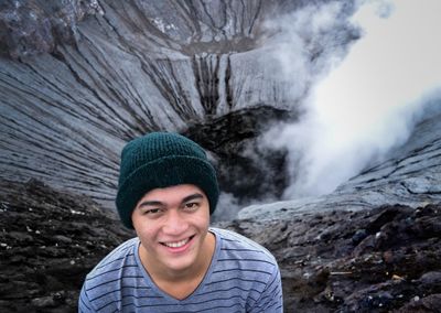 Portrait of smiling young man in bromo mountain.