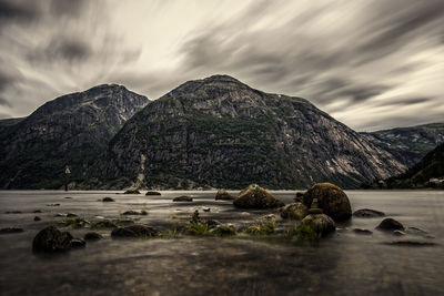 Surface level of rocks in mountains against sky