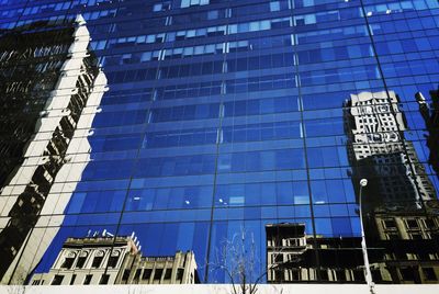 Low angle view of building against blue sky