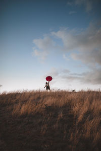 Girl soars with an umbrella