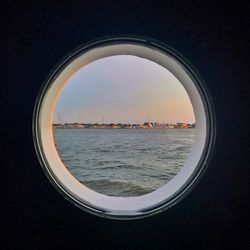 Close-up of sea seen through window