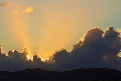 Scenic view of mountains against sky during sunset