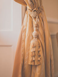 Close-up of clothes hanging on wall at home