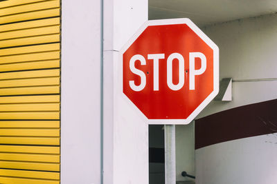 Stop sign against building