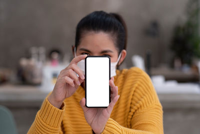 Portrait of man using mobile phone