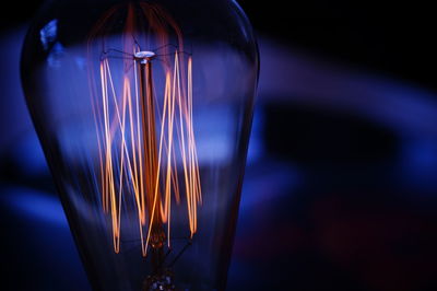 Close-up of illuminated light bulb