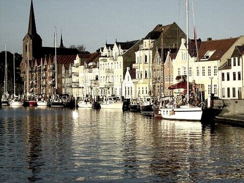 building exterior, architecture, nautical vessel, built structure, water, waterfront, transportation, boat, mode of transport, moored, city, river, canal, harbor, reflection, travel, rippled, outdoors, building, travel destinations