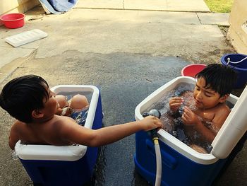 High angle view of siblings and woman