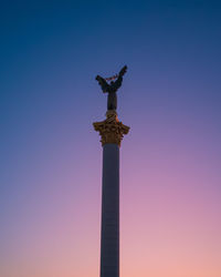 Low angle view of statue of liberty against sky