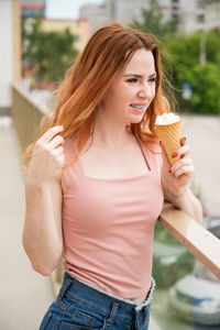 Young woman holding ice cream