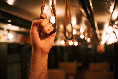 Human hand holding in a transportation vehicle