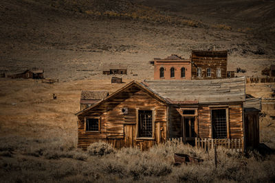 Abandoned house on field