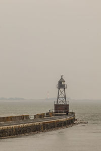 A lighthouse in foggy weather. 