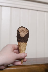 Midsection of person holding ice cream cone