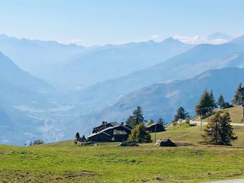 Scenic view of landscape and mountains against sky