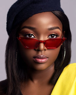 Close-up portrait of young woman wearing sunglasses