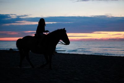Scenic view of sea at sunset
