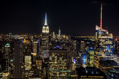 Illuminated buildings in city at night