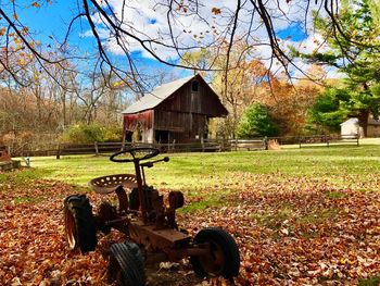 Abandoned house on field during autumn