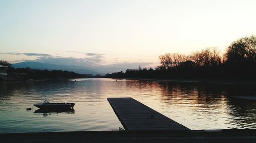 Scenic view of lake against sky during sunset