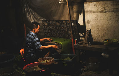 Man working on barbecue grill
