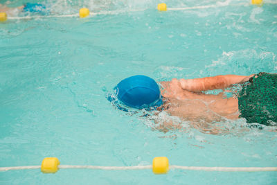 High angle view of man swimming in pool