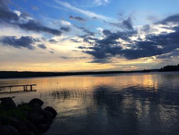 Scenic view of lake at sunset