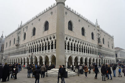 Group of people in front of historical building