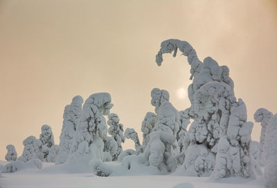 Statue against clear sky during winter