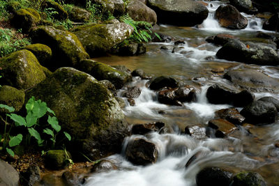 Stream flowing through rocks in sea