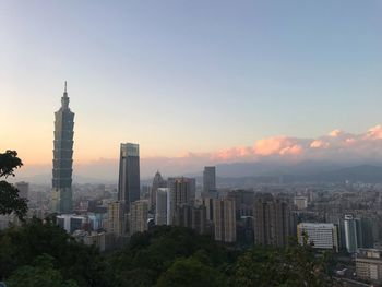 Cityscape against sky during sunset