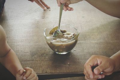 Midsection of woman holding ice cream