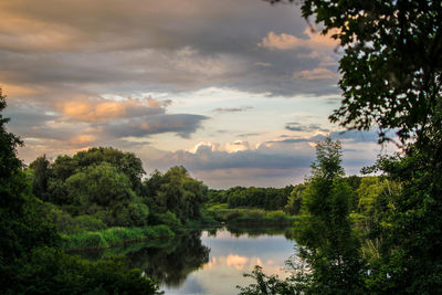 Scenic view of lake against sky during sunset