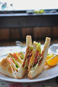 Close-up of sandwiches on plate at restaurant table