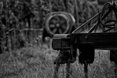 Close-up of rusty metal on field