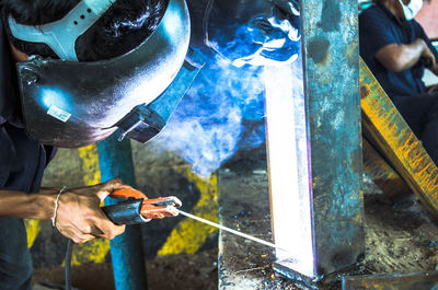 Close-up of man welding metal