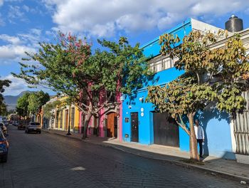 Street amidst buildings against sky