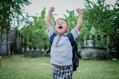 Full length of boy standing on field