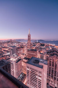 High angle view of city buildings against clear sky