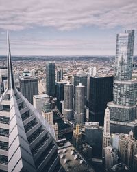 Cityscape against cloudy sky