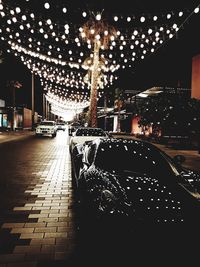 Wet illuminated car at night